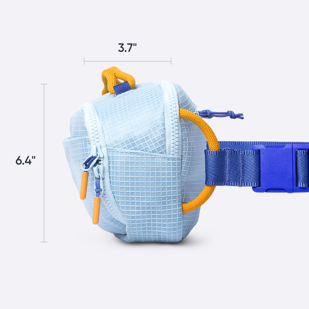 Owala All-Day Crossbody in Rest Azured, light blue ripstop grid belt bag with yellow accent loops and periwinkle strap, side view dimensioned at 3.7 inches deep and 6.4 inches tall