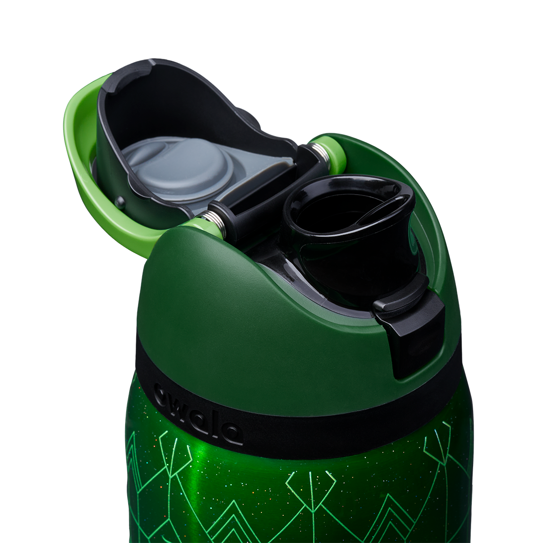 Owala FreeSip 32oz in Elphaba, dark green flip cap open showing FreeSip spout with bright green carry loop on green art deco patterned body